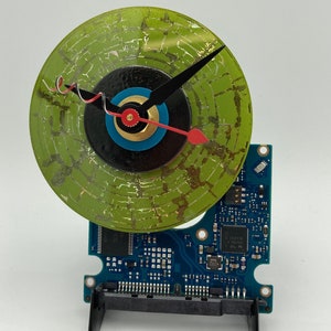 Mini CD on blue laptop  circuit board clock, table or shelf display