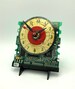 Mini cd with gold tone numeral face on circuit board clock, shelf or table display, circuit boards will vary, easel stand included. 