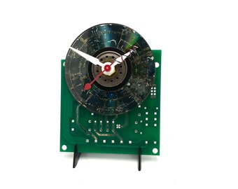 Altered mini CD with center on unpopulated circuit board clock, easel stand & AA  included.