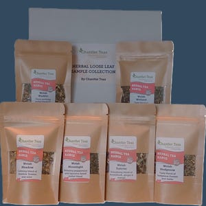 May include: A collection of six small brown paper bags containing loose leaf herbal tea blends. Each bag features a label with the Chantler Teas logo and the name of the tea blend, such as "Welsh Warbler" and "Welsh Meadow".