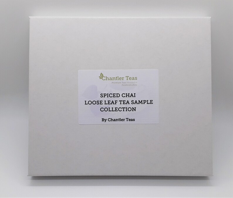 May include: A white box with a label that reads "Spiced Chai Loose Leaf Tea Sample Collection by Chantler Teas".