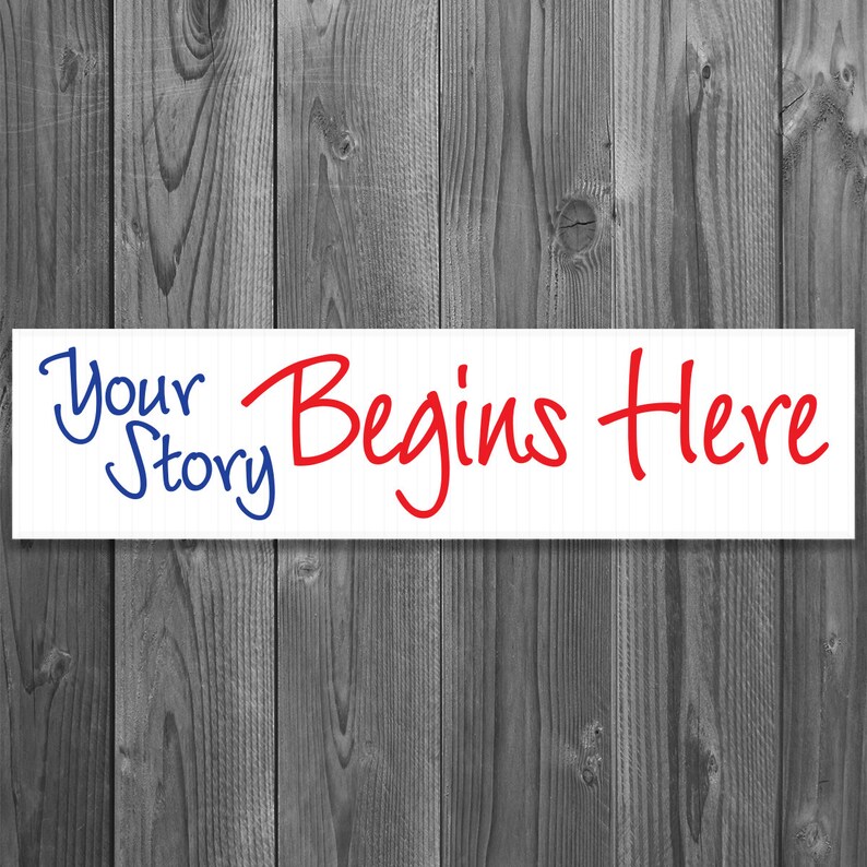 6 x 24 inch real estate rider against washed grey wood backdrop. It is made of aluminum metal and has a white background with bold red and blue scripted font. Says your story begins here.