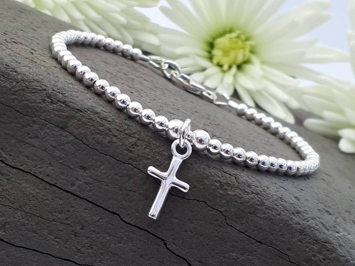 Cross Sterling Silver Bracelet with Cord plated in Gold main image 1