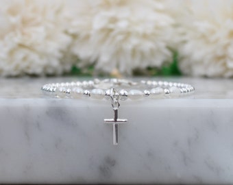 Sterling silver cross bracelet for women or girls with optional personalised initial tag. Confirmation gift.