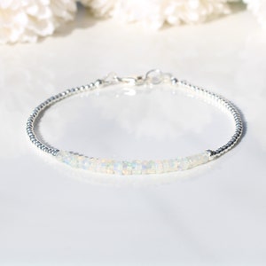 October birthstone bracelet. Ethiopian welo opal bracelet in sterling silver with optional personalised tag.