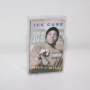 May include: A clear plastic cassette tape case featuring the album "Kill at Will" by Ice Cube. The album cover shows a portrait of Ice Cube with the text "Ice Cube" and "Kill at Will". The case has a parental advisory sticker.