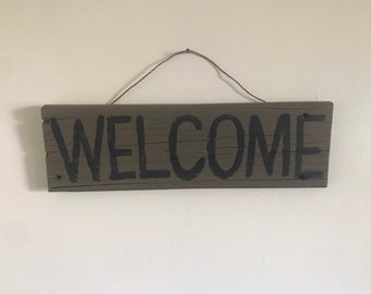 Rustic hand painted WELCOME sign