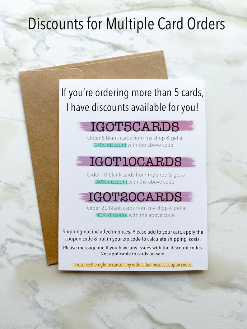 May include: A white card with pink and blue brushstrokes. The card lists discounts for ordering multiple blank cards. The discounts are 20%, 30%, and 40% for orders of 5, 10, and 20 cards, respectively. The discount codes are IGOT5CARDS, IGOT10CARDS, and IGOT20CARDS.