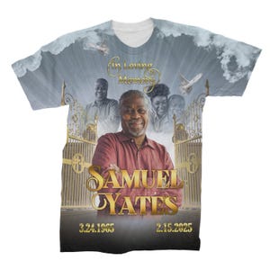 May include: A white t-shirt with a photo of a man in a red shirt. The shirt has a gold border with the text "In Loving Memory" and "Samuel Yates" with the dates "3.24.1965" and "2.15.2025".
