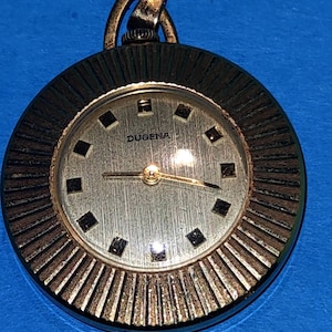 Wspaniały antyczny wiszący zegarek do łańcucha, kobieta, dama, pani, DUGENA złoto, 12 karatów szlachetne art deco Arte & Antiques Xarreque