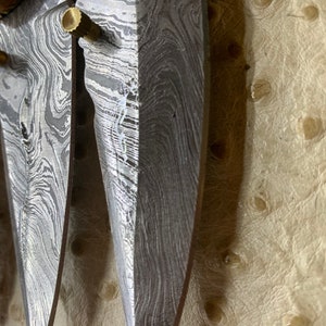 Coltello pieghevole in Damasco.