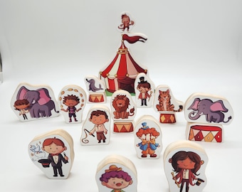 May include: A set of wooden toy figurines depicting a circus theme. The set includes a clown, a lion, an elephant, a magician, and other characters. The figurines are painted in bright colors and have a whimsical design.
