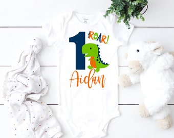 Dinosaur 1st Birthday Shirt, Dinosaur First Birthday Boy Onesie®, 1st Birthday Baseball Raglan Personalized with Name, Dinosaur Party