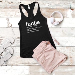May include: Black tank top with a white graphic that says "funtie" and defines the word as "The fun aunt. Like a mom, only way cooler."