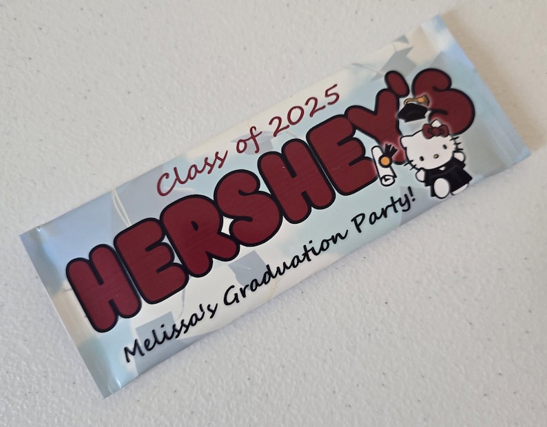 May include: A blue and white Hershey's chocolate bar wrapper with the text "Class of 2025" and "Melissa's Graduation Party!"  A cartoon image of Hello Kitty wearing a graduation cap is on the wrapper.