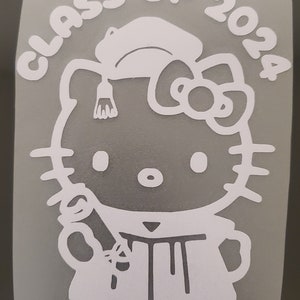 May include: White vinyl sticker of Hello Kitty dressed in a graduation cap and gown, holding a diploma. The text "Class of 2024" surrounds the character.