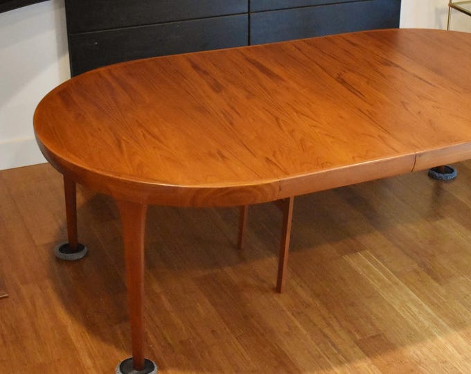 Restored Danish teak round-to-oval expandable dining table by Kofod Larsen - 87" long