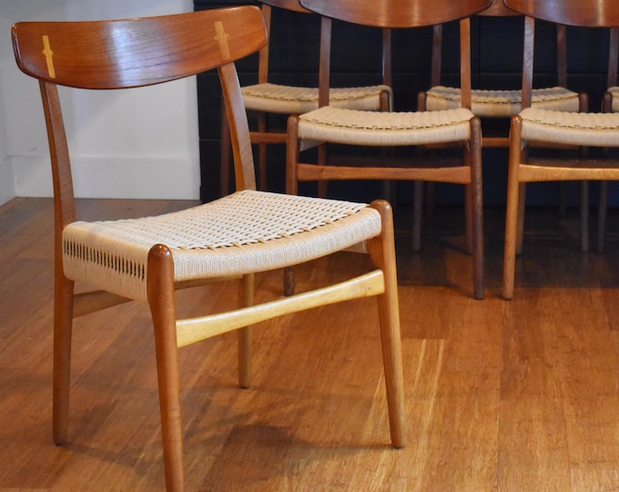 Six restored Danish teak and golden oak Hans Wegner CH-23 dining chairs, circa 1960s