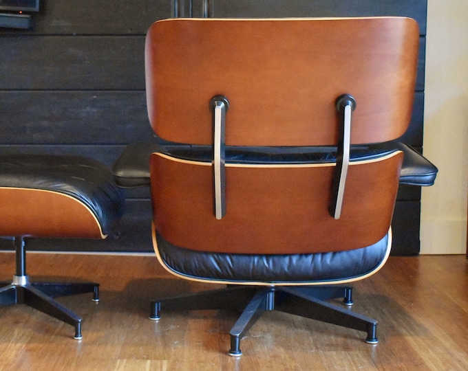 Restored Eames cherry lounge chair and ottoman by Herman Miller, circa 2002