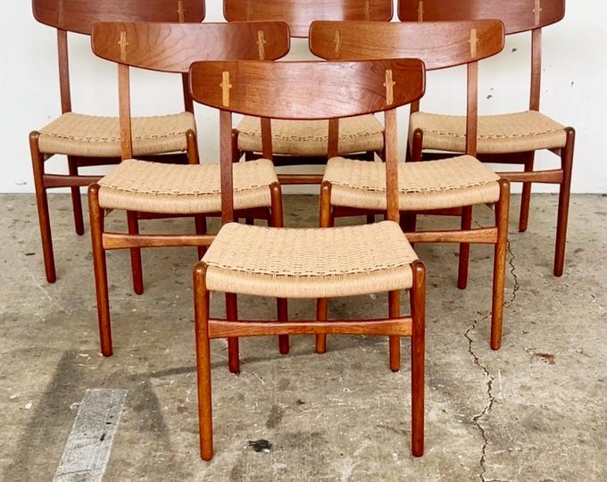 Six restored Danish teak and golden oak Hans Wegner CH-23 dining chairs, circa 1960s