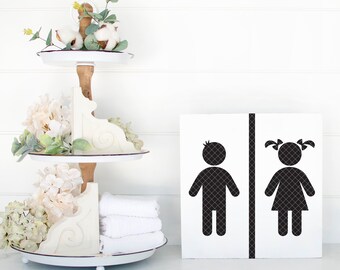 May include: White wooden sign with black silhouette images of a boy and girl with the text "WOODWORKS" at the bottom.