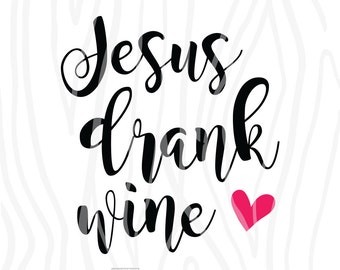 May include: Black and white calligraphy text that reads "Jesus drank wine" with a pink heart to the right of the text.