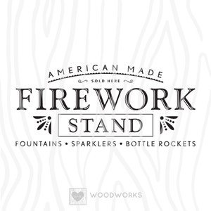 May include: Black and white graphic design for a firework stand. The text reads "American Made" with a decorative flourish and "Sold Here". Below the text is "FIREWORK STAND" with a decorative flourish on either side. The text "FOUNTAINS SPARKLERS BOTTLE ROCKETS" is below the stand. The text "WOODWORKS" is below the stand with a heart logo.