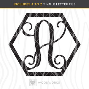 May include: Black and white monogram letter A in a hexagonal frame. The letter is in a cursive font with a decorative flourish. The frame is outlined in black.