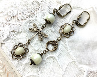 Asymmetrical cream cabochon floral dangle earrings antique brass mismatched cabochon earrings