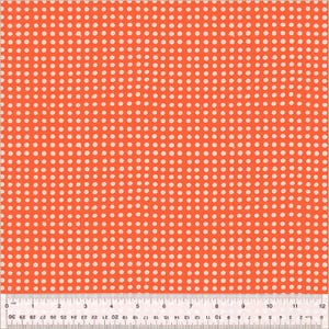 May include: Close-up of a fabric with a repeating pattern of small, off-white polka dots on a bright orange background. A ruler is at the bottom, showing inches and centimeters.