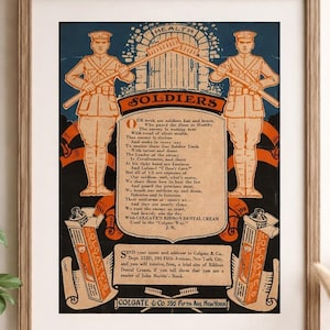 May include: A framed vintage advertisement for Colgate's Ribbon Dental Cream. The print features two soldiers, text, and illustrations of the product packaging. The color scheme includes orange, blue, and black.