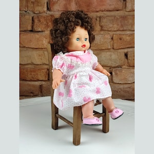Baby doll in pink original dress. 1980s doll. A perfect gift for a baby girl. Doll with curls. Doll in pink shoes.