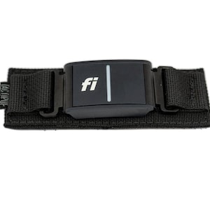 May include: Black strap with a black rectangular device that has the word "fi" printed in white on it.