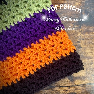 May include: A crochet blanket with stripes of green, purple, orange, and black yarn. The blanket is labeled "PDF Pattern Lacey Halloween Blanket".