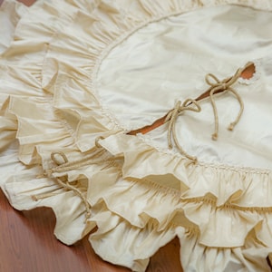 Silk Christmas tree skirt with ruffles in ivory color. 100% silk. Available size