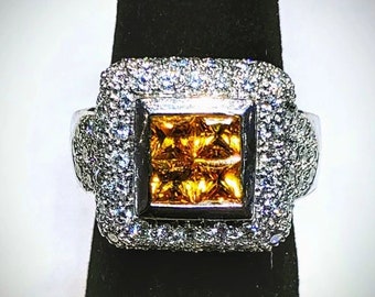 Platinum ring set with Diamonds and yellow Sapphire's