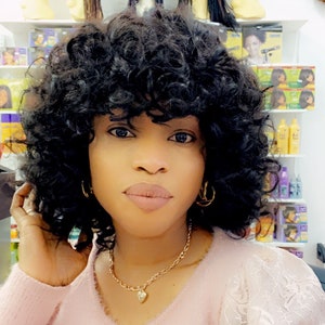 Virgin hair curly bob full weave . Colours 2 and 4. Lenght 8 inch