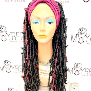 May include: A mannequin with long black and burgundy locs, wearing a burgundy headband with a knot on top. The mannequin is wearing a gold chain necklace.