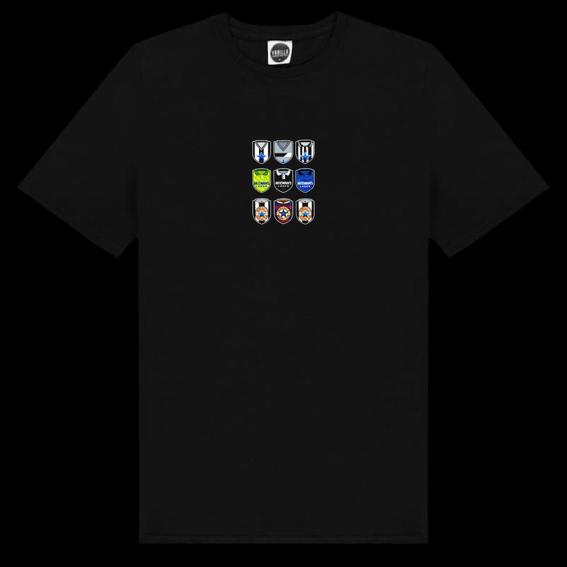 May include: Black t-shirt featuring nine colorful shield-shaped emblems. Each emblem has a unique design with various colors and shapes. The shirt has a crew neck and short sleeves. The shirt is made of a soft material.