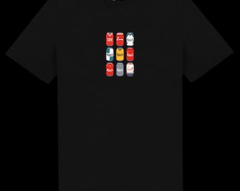 May include: Black t-shirt with a grid of nine beer can illustrations. The cans are in various colours, including red, white, and blue, with different logos. The shirt has a crew neck and a small logo near the collar.