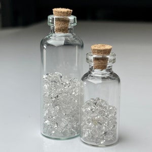 Pakimer Diamond Quartz Crystals in Glass Bottle: Petroleum Inclusions