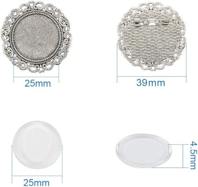 May include: Two silver-toned metal round frames with a decorative design. The larger frame measures 39 mm in diameter and has a pin back. The smaller frame measures 25 mm in diameter and has a flat back. Two clear glass circles, one measuring 25 mm in diameter and the other measuring 4.5 mm in diameter.