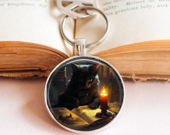 読書中の黒猫キーホルダー：キャンドルライト画像、猫ママへのギフト