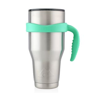 May include: A stainless steel tumbler with a green silicone handle and lid. The tumbler has a mountain range design and the text "Ello" on the lid.