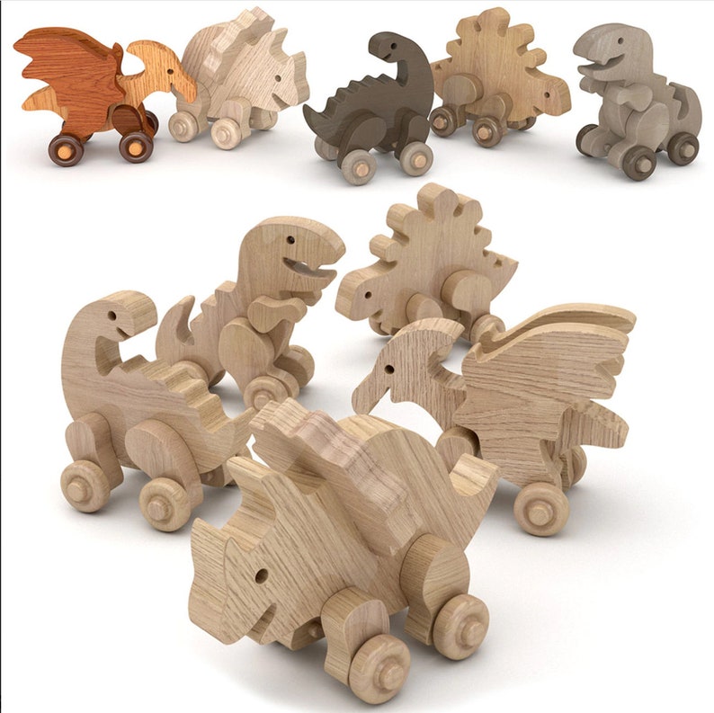 May include: A set of wooden toy dinosaurs, including a triceratops, stegosaurus, pterodactyl, and a T-Rex. The dinosaurs are painted in natural wood tones and have wheels for rolling.