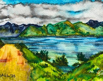 May include: Watercolour landscape painting depicting a road leading to a lake, with green hills and mountains in the background. The sky is blue with grey clouds. The painting is signed "LHALL '25" in the lower left corner.