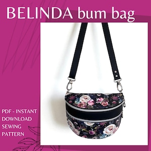 May include: A black bum bag with a floral design of pink and white roses. The bag has a curved shape with two zippered compartments and a black adjustable strap. The text "BELINDA bum bag" is at the top.