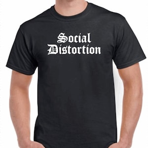 May include: A black t-shirt with the words "Social Distortion" printed in white in a gothic font.