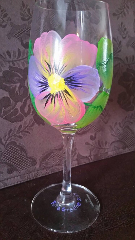 Spring will be here soon, what better way to celebrate than with this wine goblet with beautiful handpainted pink and purple pansies.