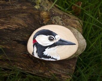 Great spotted woodpecker painting on a recycled wood slice